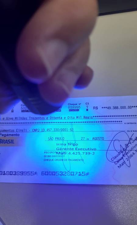 Luz ultravioleta confirma falsificação de cheque de R$ 49,3 milhões 3
