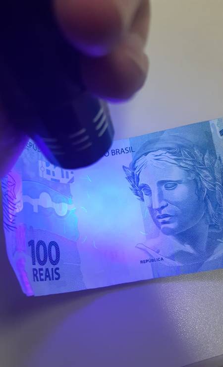 Luz ultravioleta confirma falsificação de cheque de R$ 49,3 milhões 4